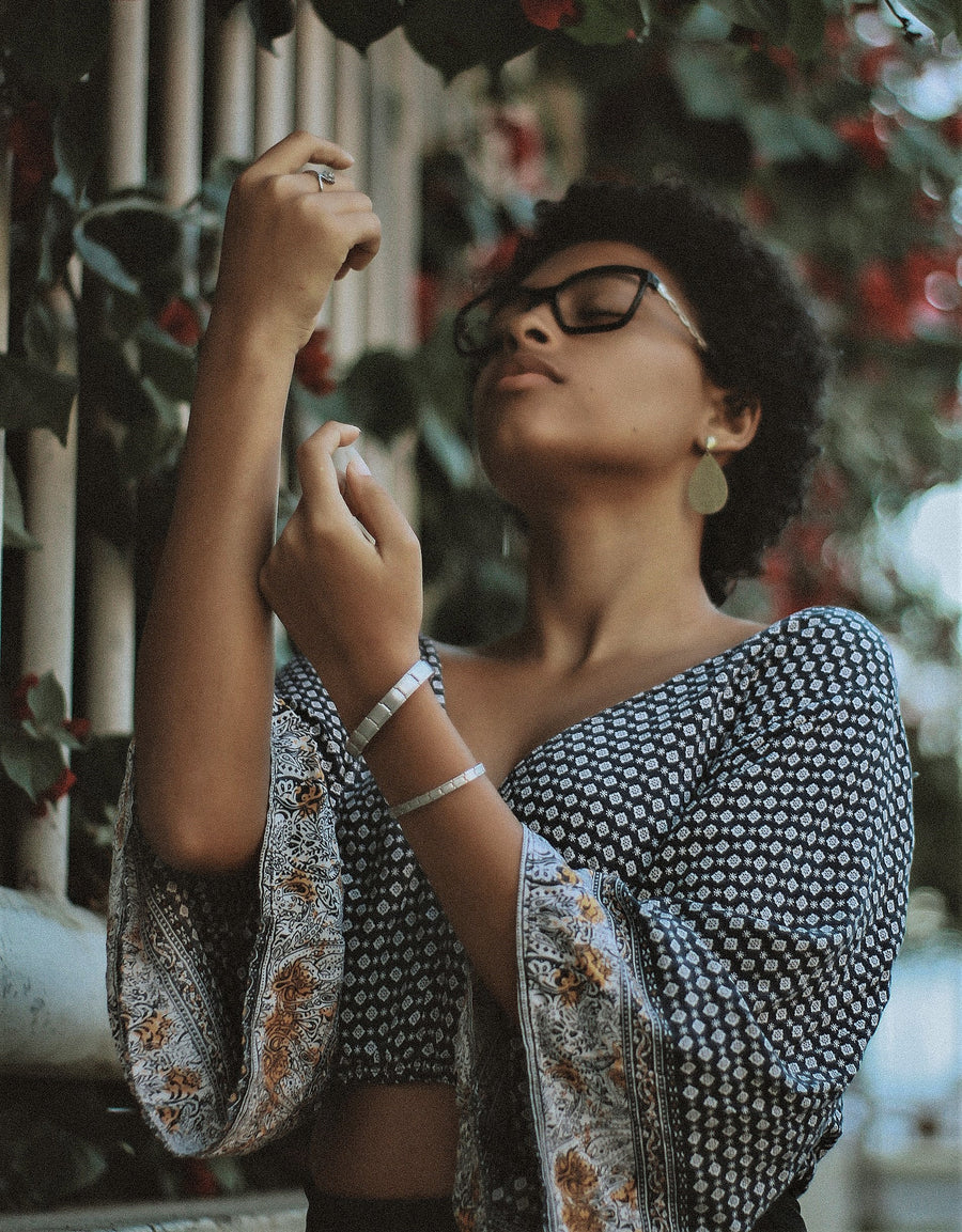 Women Spraying Perfume on Herself